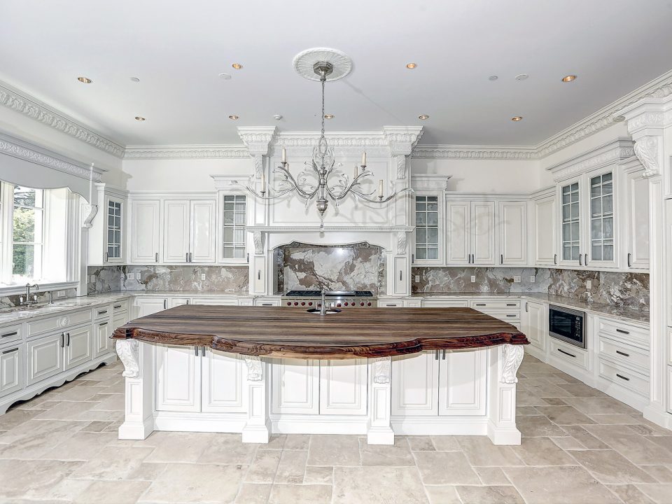 Natural and Luxury, gourmet Kitchen with custom cabinetry and custom crown moldings