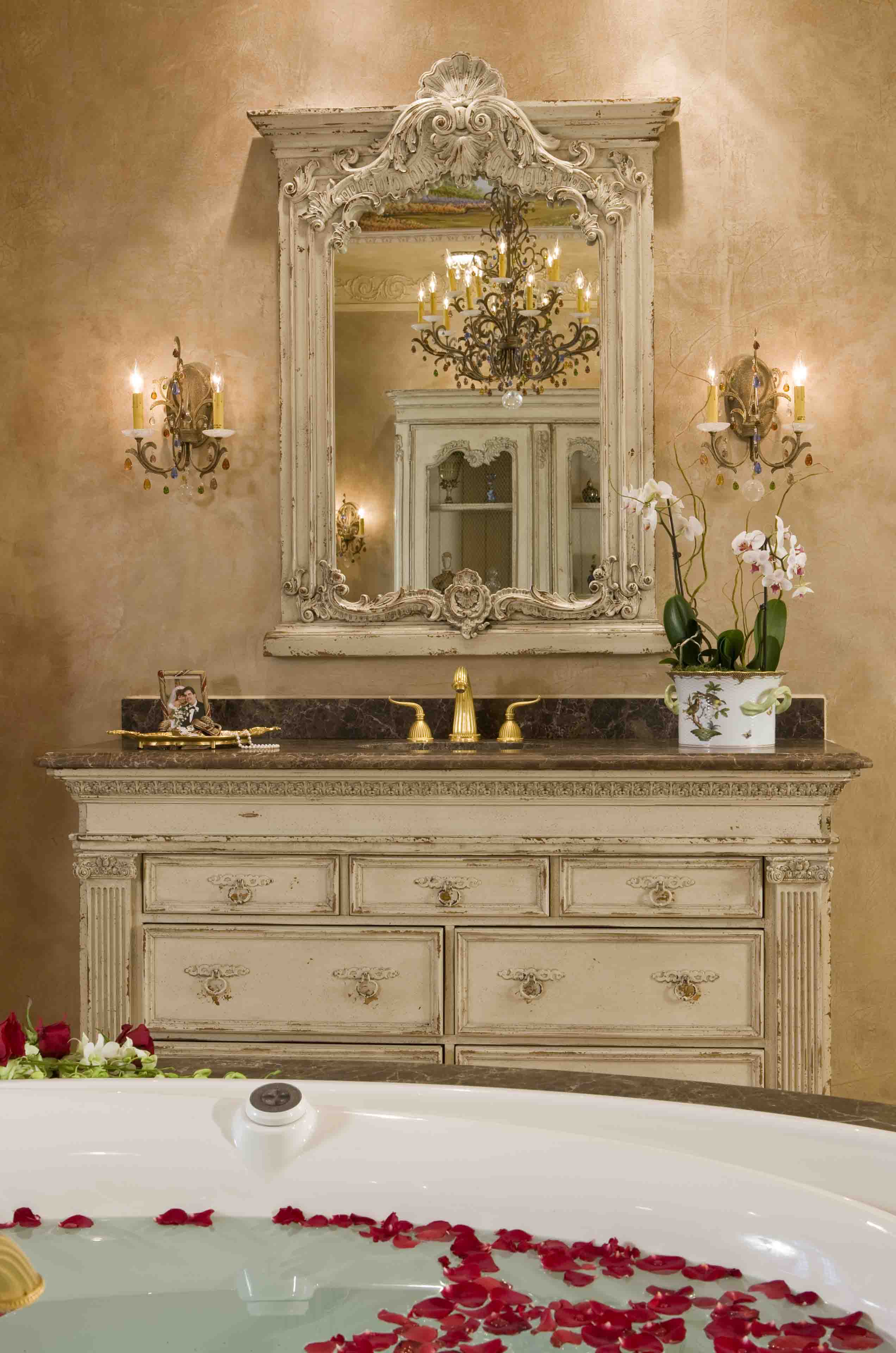 Luxury master bathroom with custom antique cabinets and spa