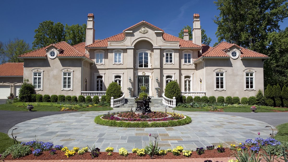 Mediterranean House Entrance with Circular Driveway and garden