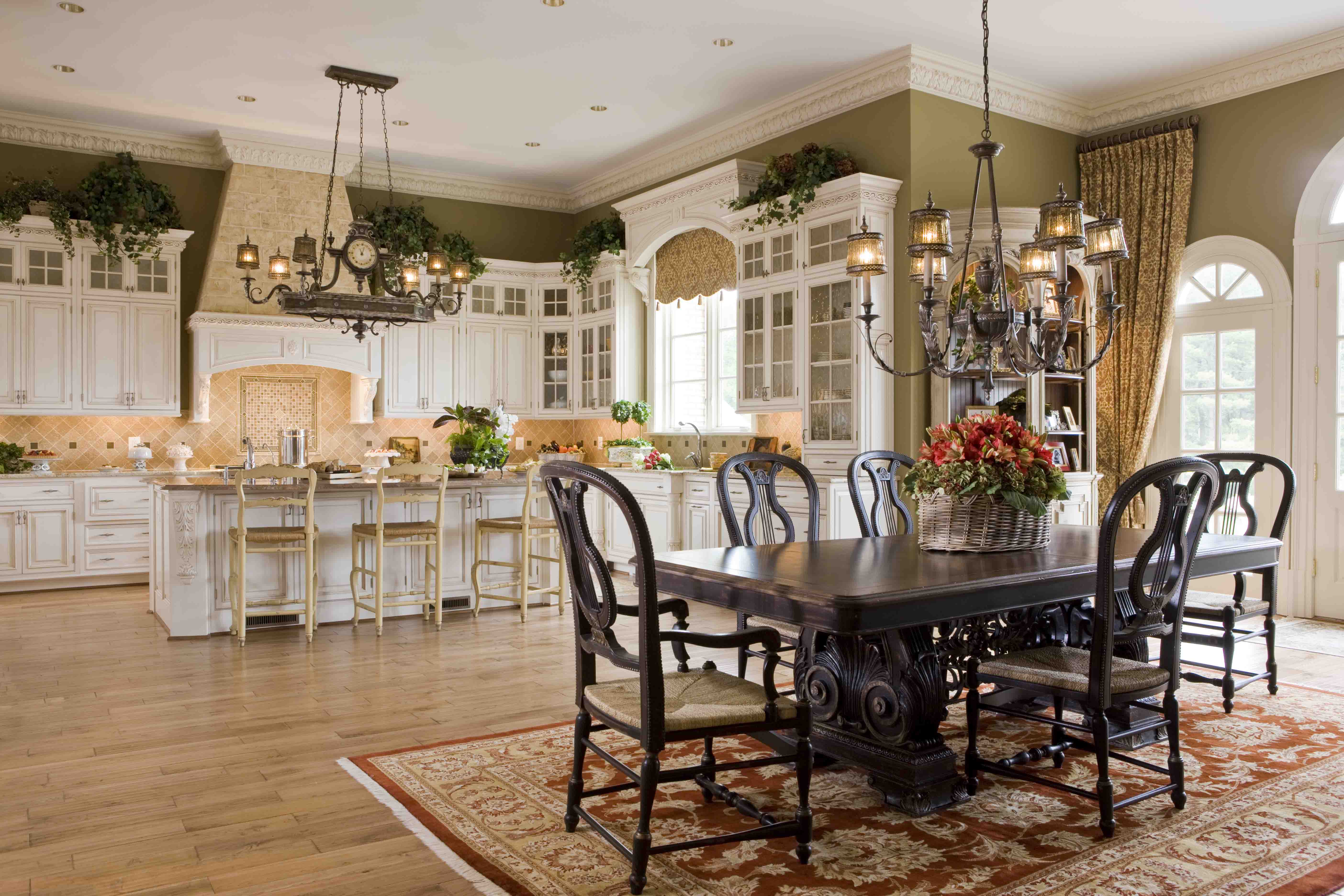 Luxury kitchen with custom cabinetry and dining table in mansion in Potomac, Maryland