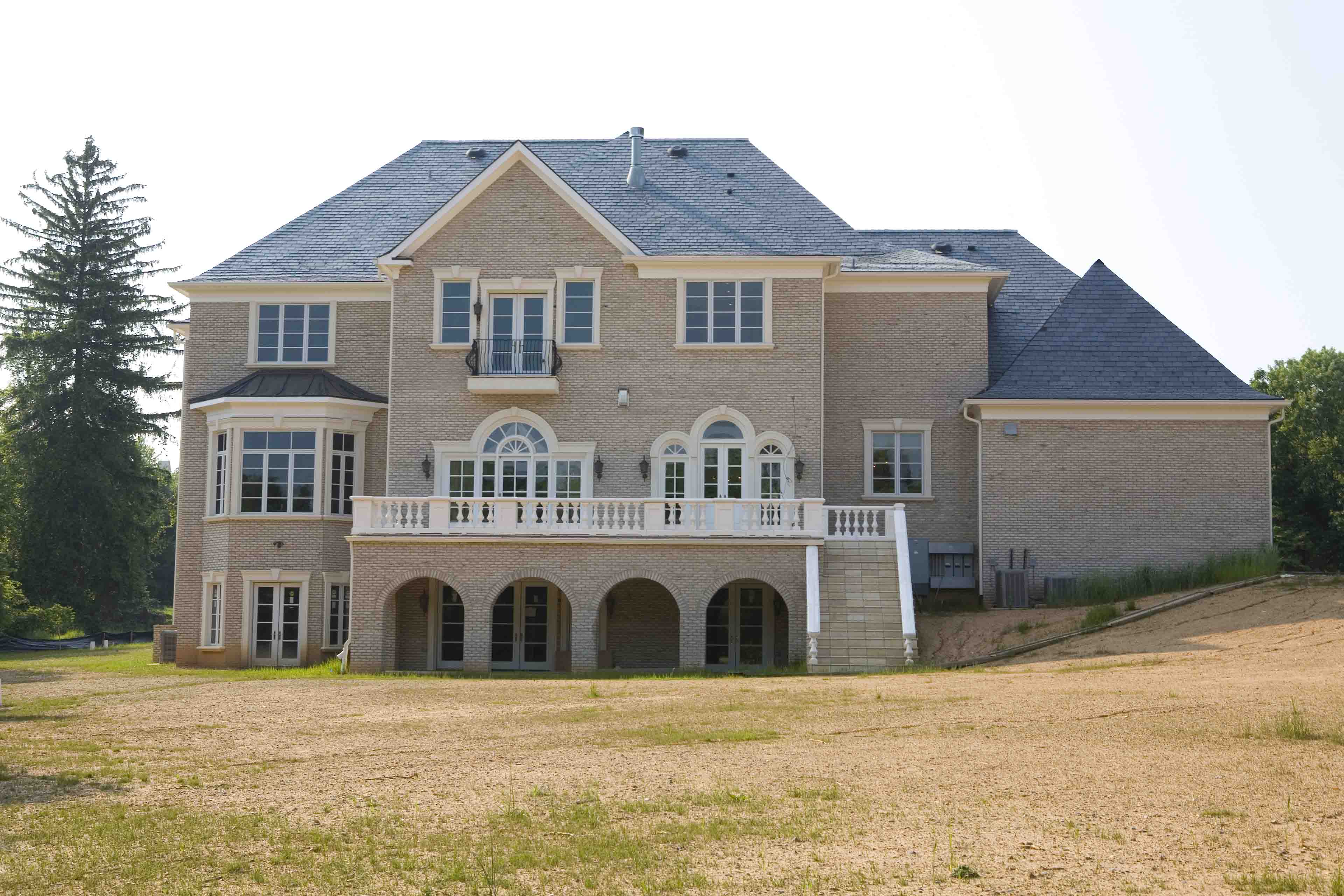 Exterior of a mansion under construction designed and built in Potomac, Maryland