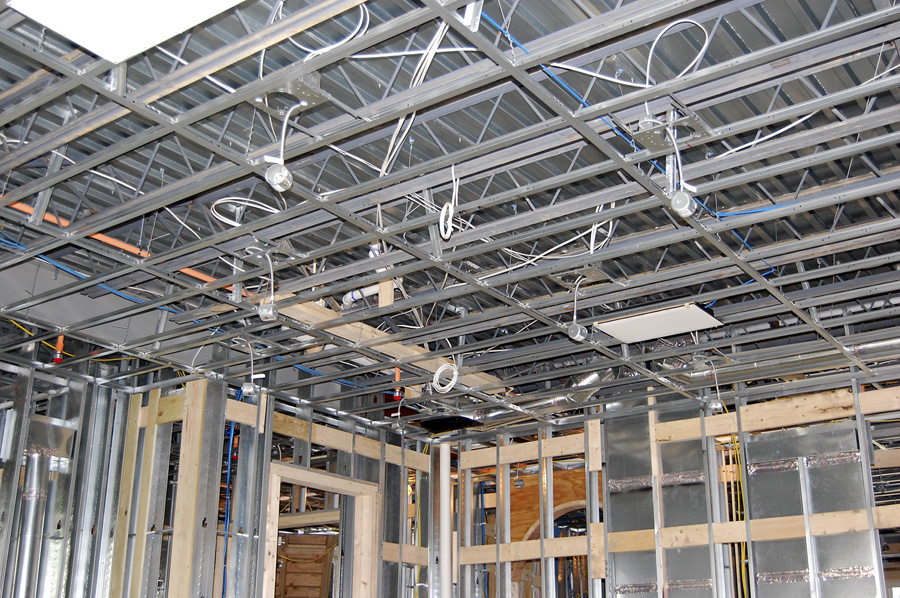 Ceiling of mansion under construction with steel and wood.