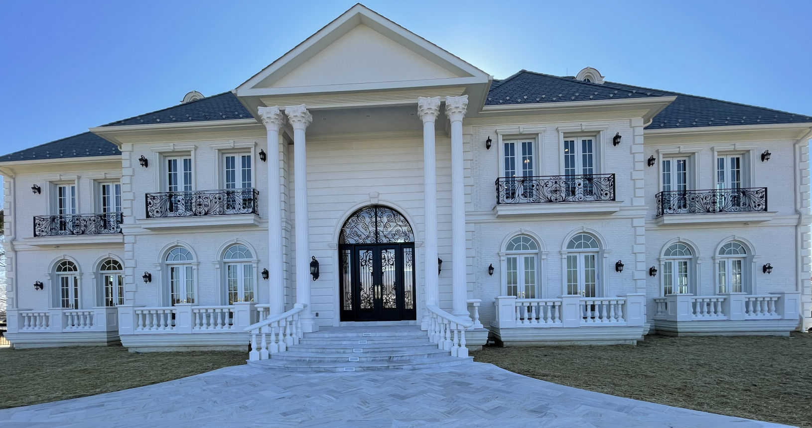 Estate Entrance with white pillars
